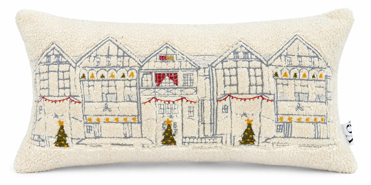Snowy Christmas High Street Lumbar Cushion on a white background