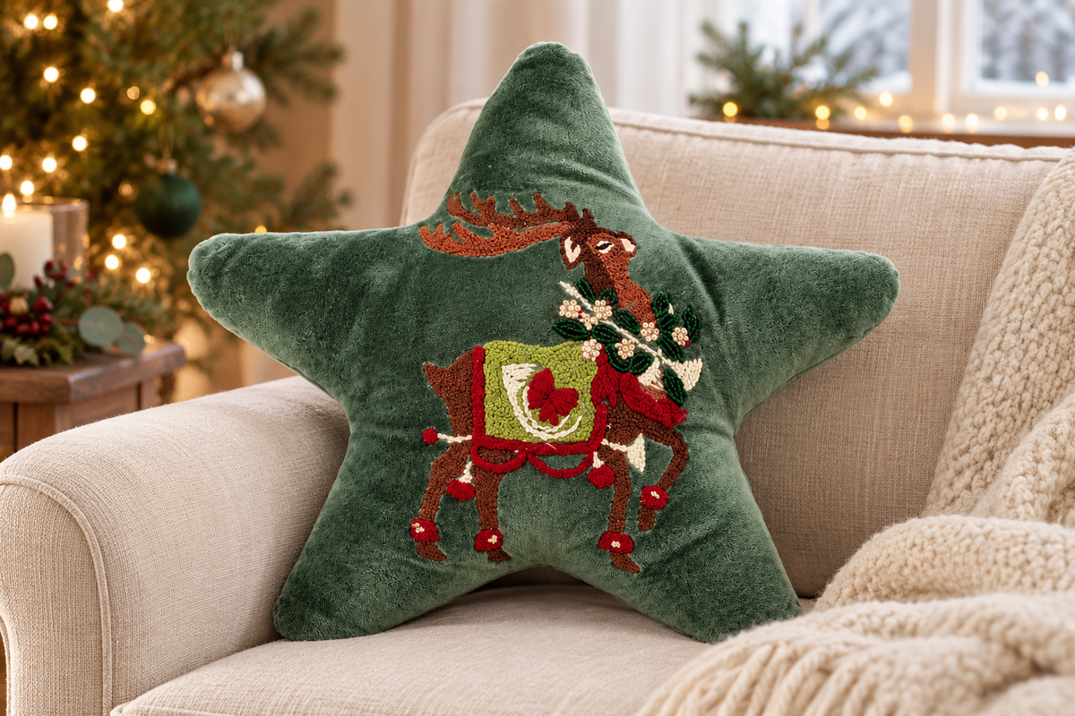 Green Reindeer Star Shaped Cushion styled in a festive living room